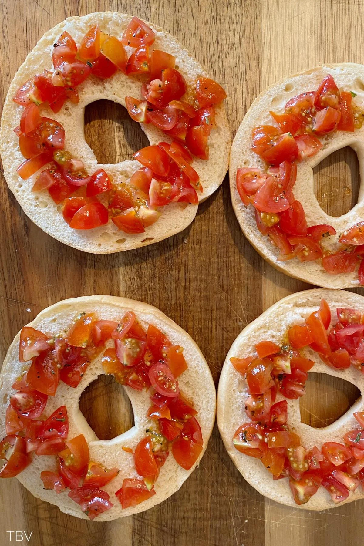 add cherry tomatoes on top of the bagel