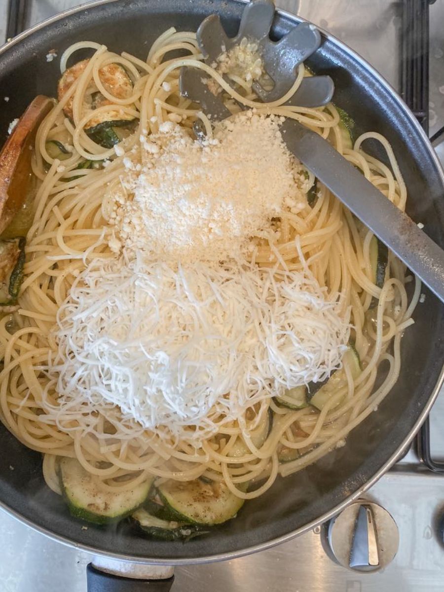 pasta with zucchini in a pan with cheeses