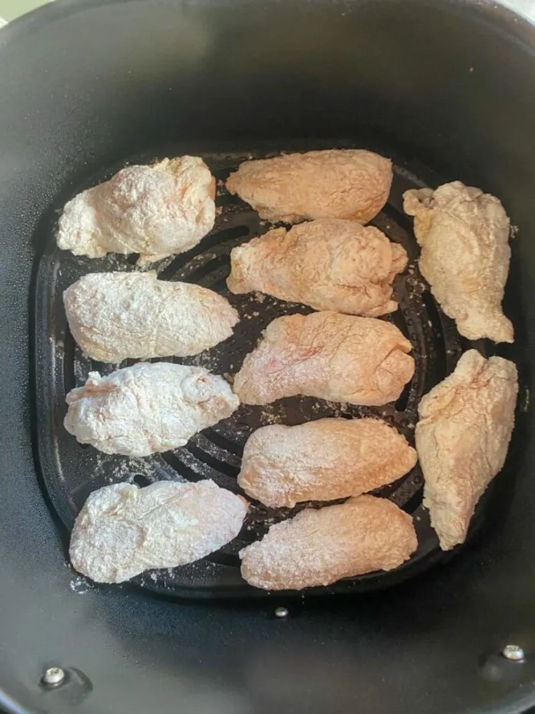 chicken wings in a single layer in the basket