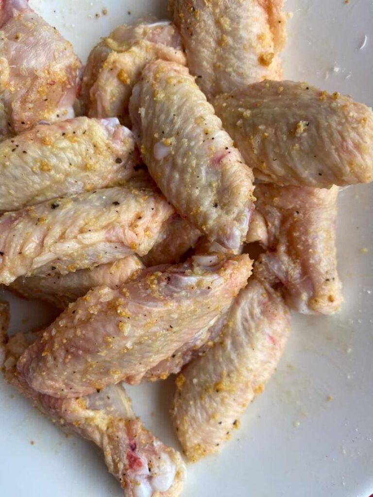 rub garlic , parmesan wings