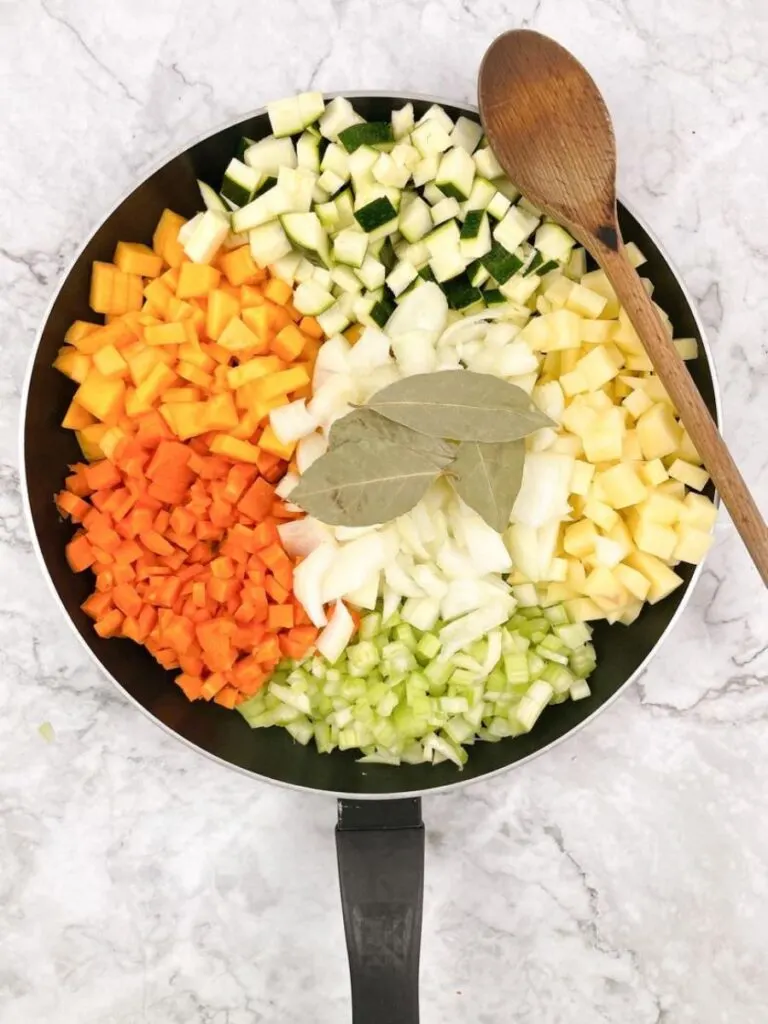 Carrots, celery, onion, squash, zucchini, potatoes and then cubed in a pan