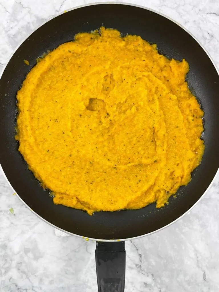 cooked vegetable puree in a pan