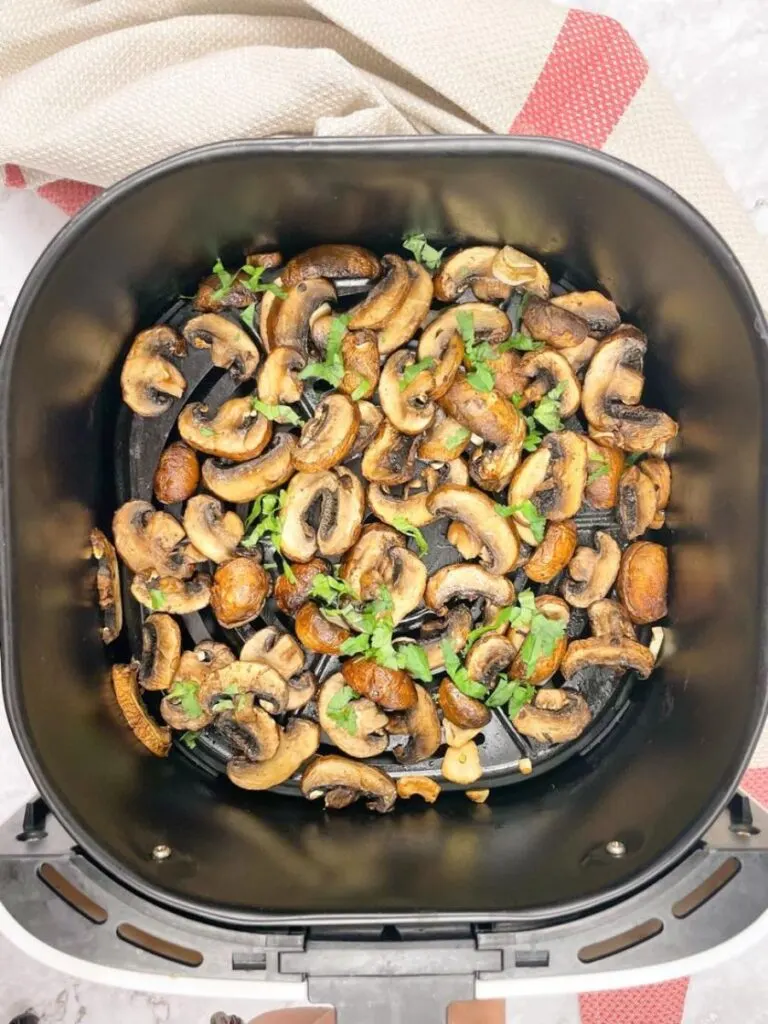 mushrooms in air fryer basket after cook