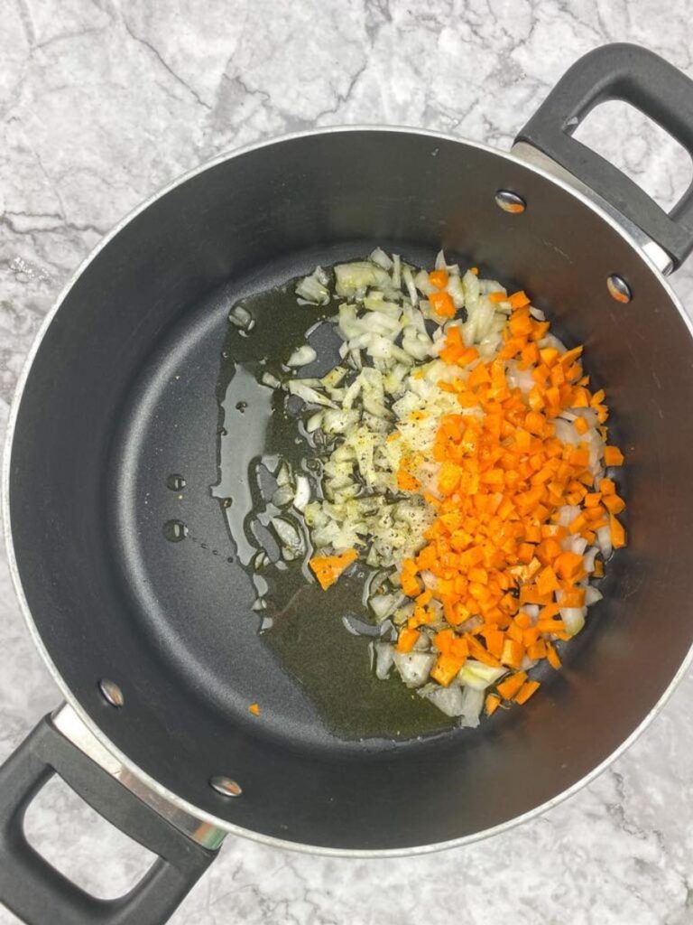 carrots and onion in the pot