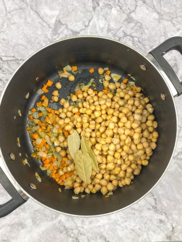 chickpeas, carrots and onion in the pot