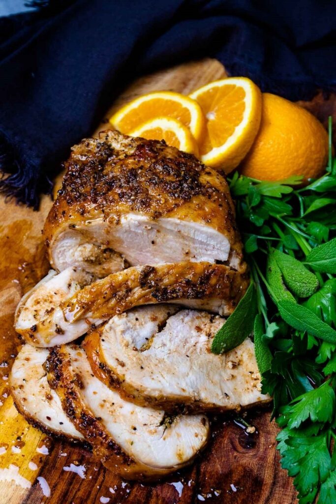 Herb-crusted roast turkey with fresh oranges and parsley