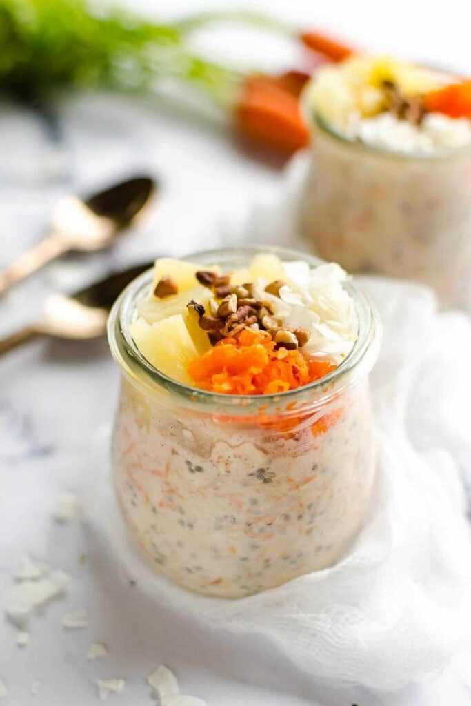 Carrot Cake Overnight Oats Jar of carrot cake overnight oats topped with pineapple, carrots, coconut, and nuts. Overnight oats recipes.