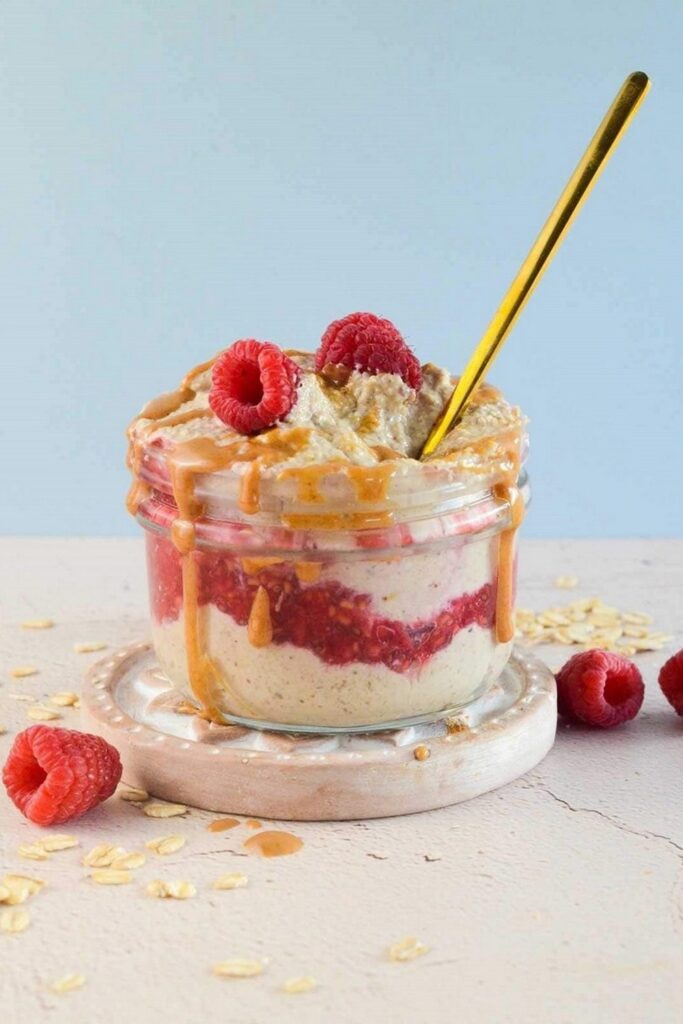 Chai Latte Overnight Oats Overnight oats recipe in a jar with raspberries and caramel drizzle. Make-ahead breakfast.