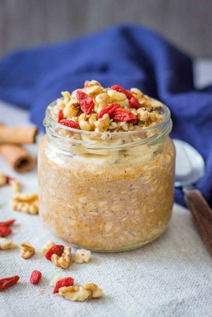 Pumpkin Overnight Oats Overnight oats recipe in a jar, topped with walnuts and goji berries. Make-ahead breakfast.