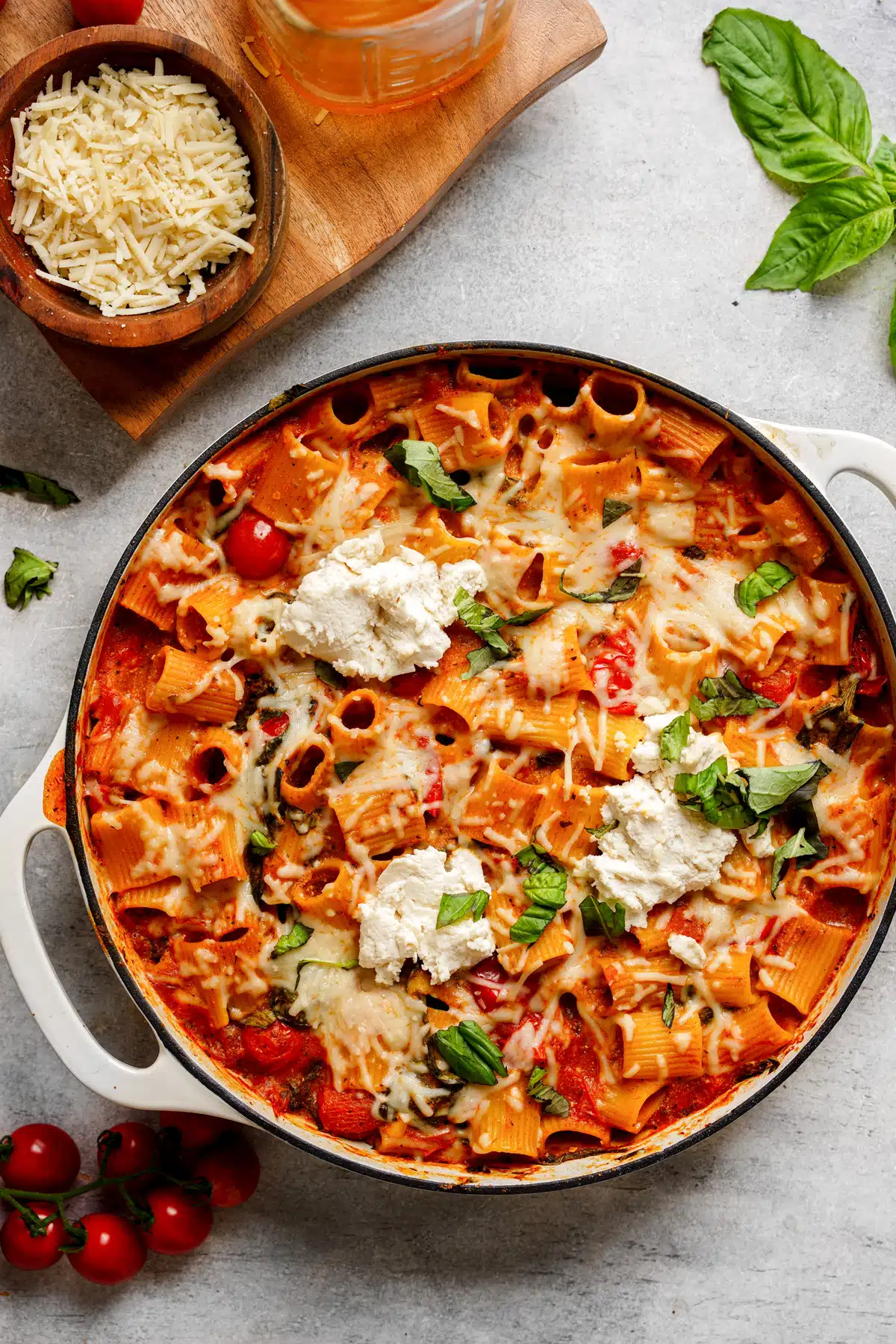 Oven-baked rigatoni with vegan ricotta, mozzarella, basil, and tomato sauce. One of many easy and delicious vegan Italian recipes.