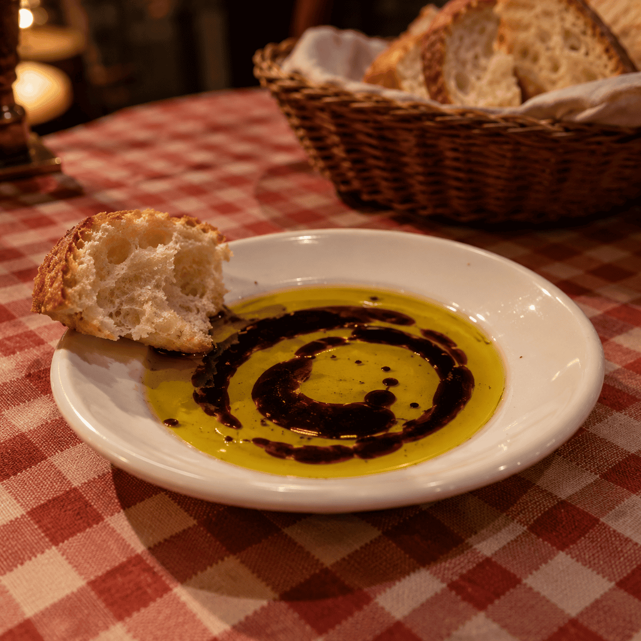 The saucer of olive oil and balsamic for the bread