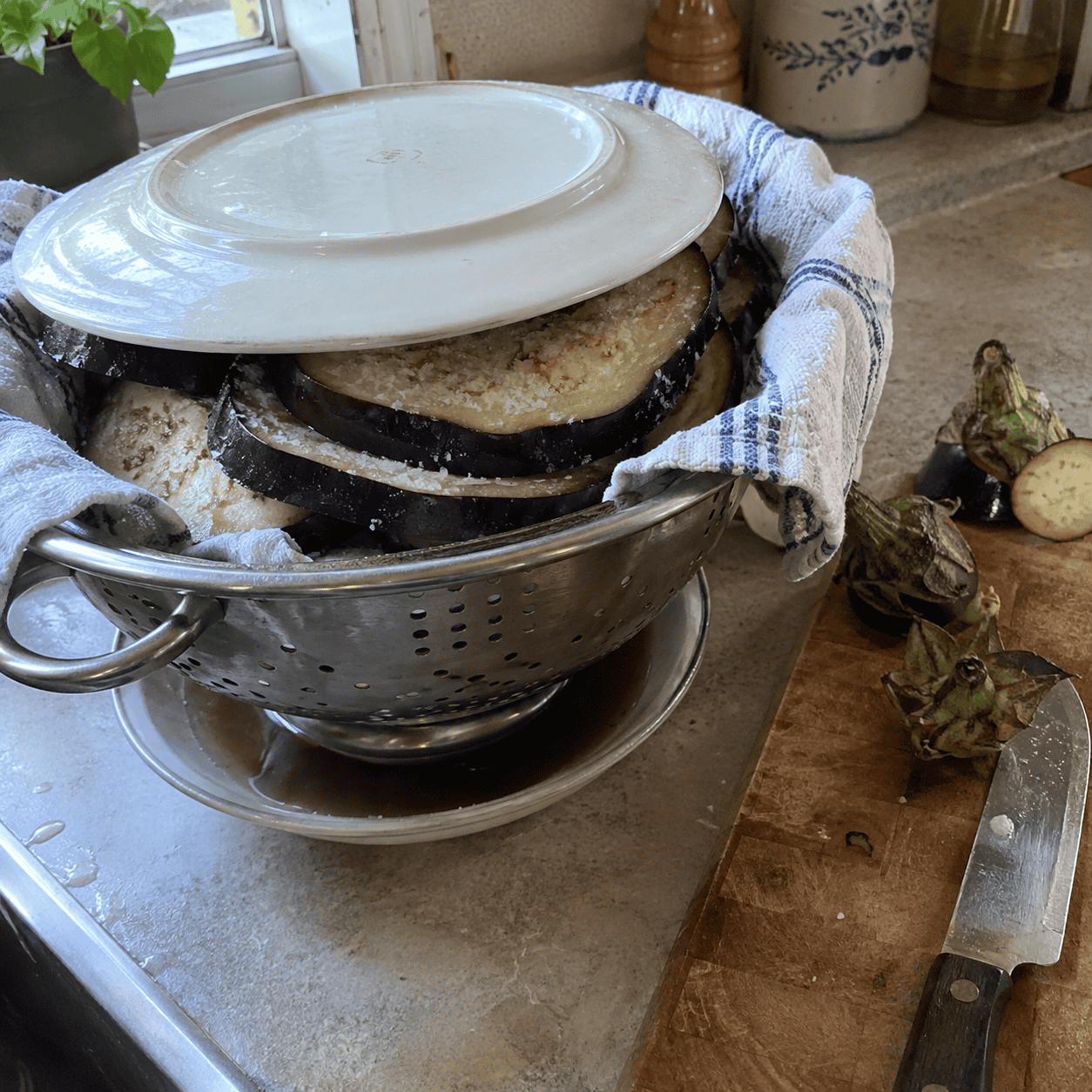 The eggplant gets salted and it gets time